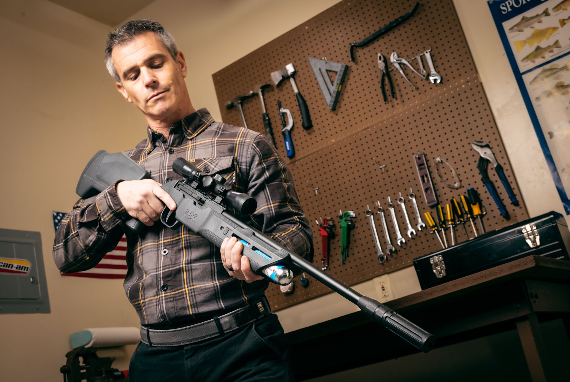 Umarex Komplete Rifle held by customer ih his garage